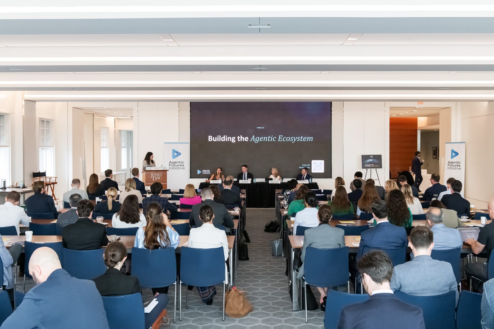 Wide view of the symposium audience during Panel One